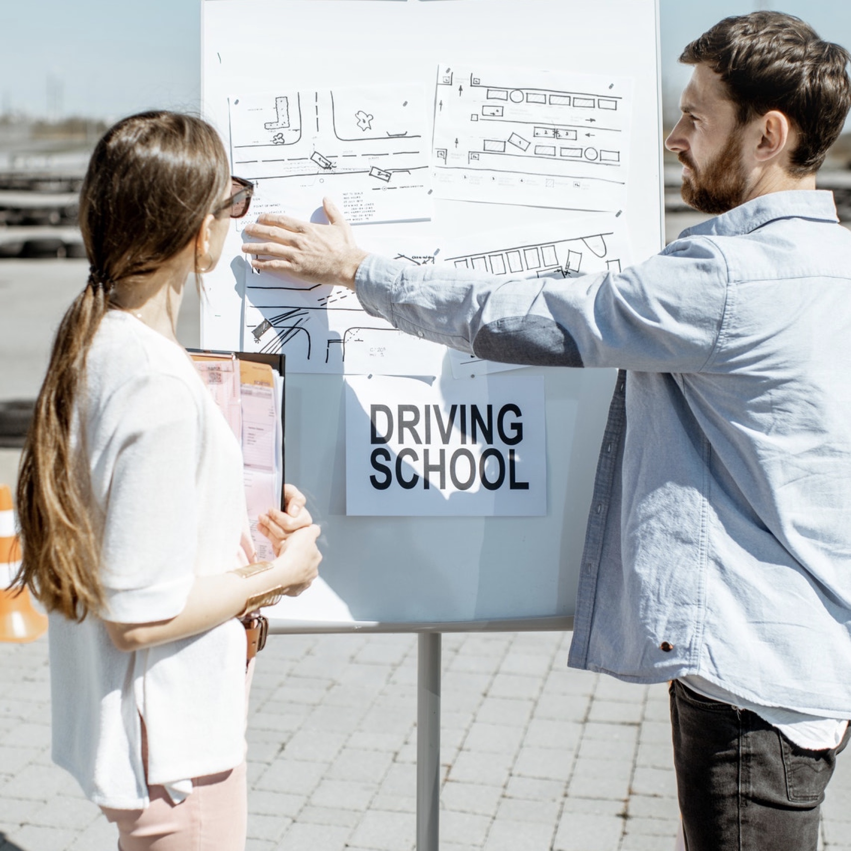 Driver Instructor showing Student Driver driving test